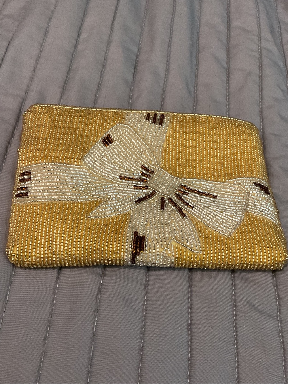 Neiman Marcus Gold Beaded Clutch with White Bow Accent